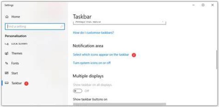How do I expand my system tray in Windows 10?